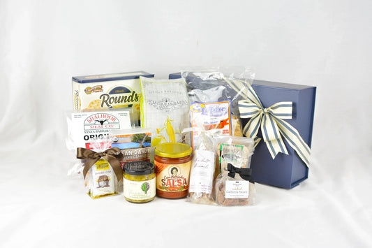 Gourmet gift box with salsa, crackers, granola, popcorn, chips, tapenade, and candied pecans with ribbon