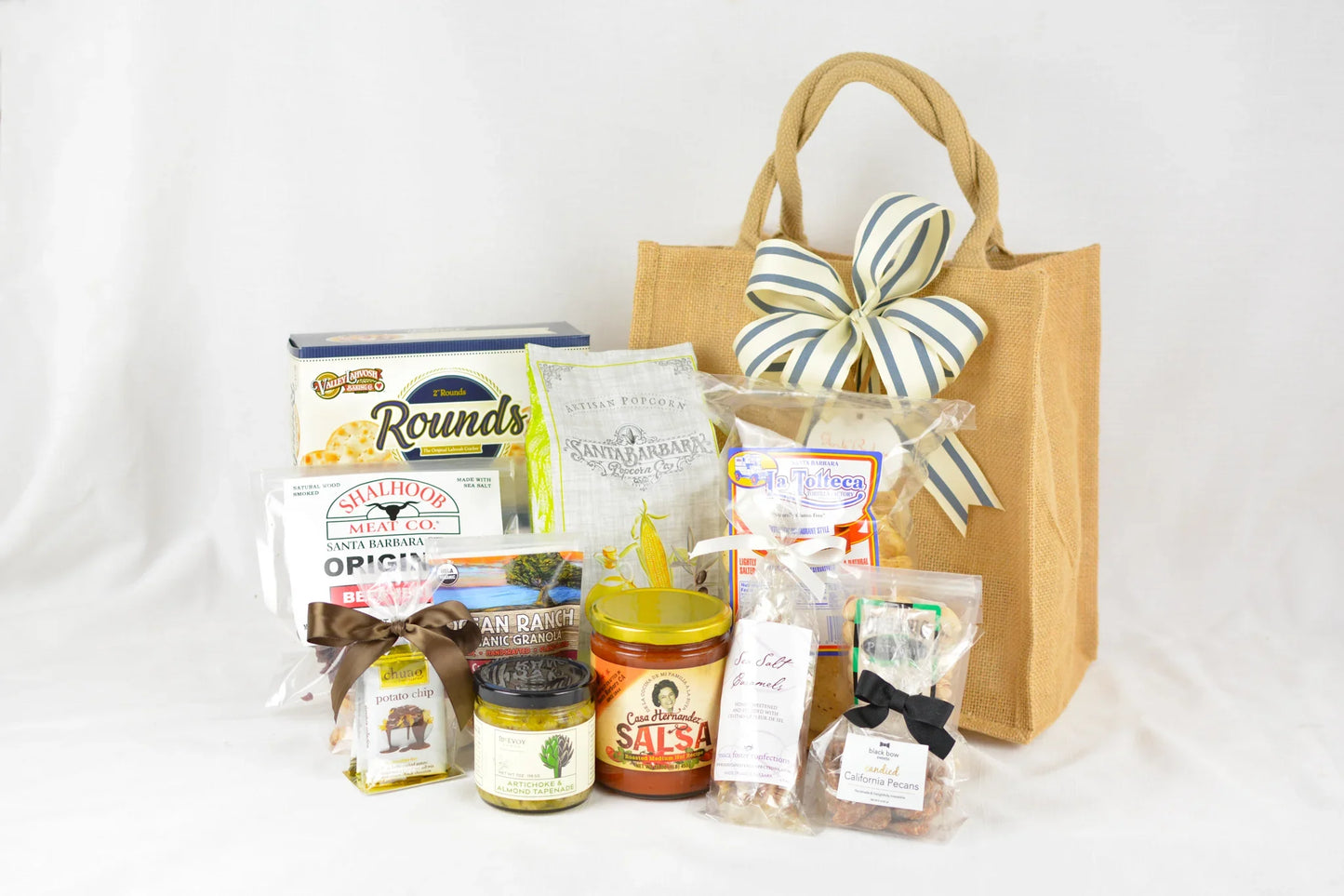 Cabrillo Crowd Pleaser Tote gift bag with snacks including salsa, popcorn, granola, crackers, and candied pecans