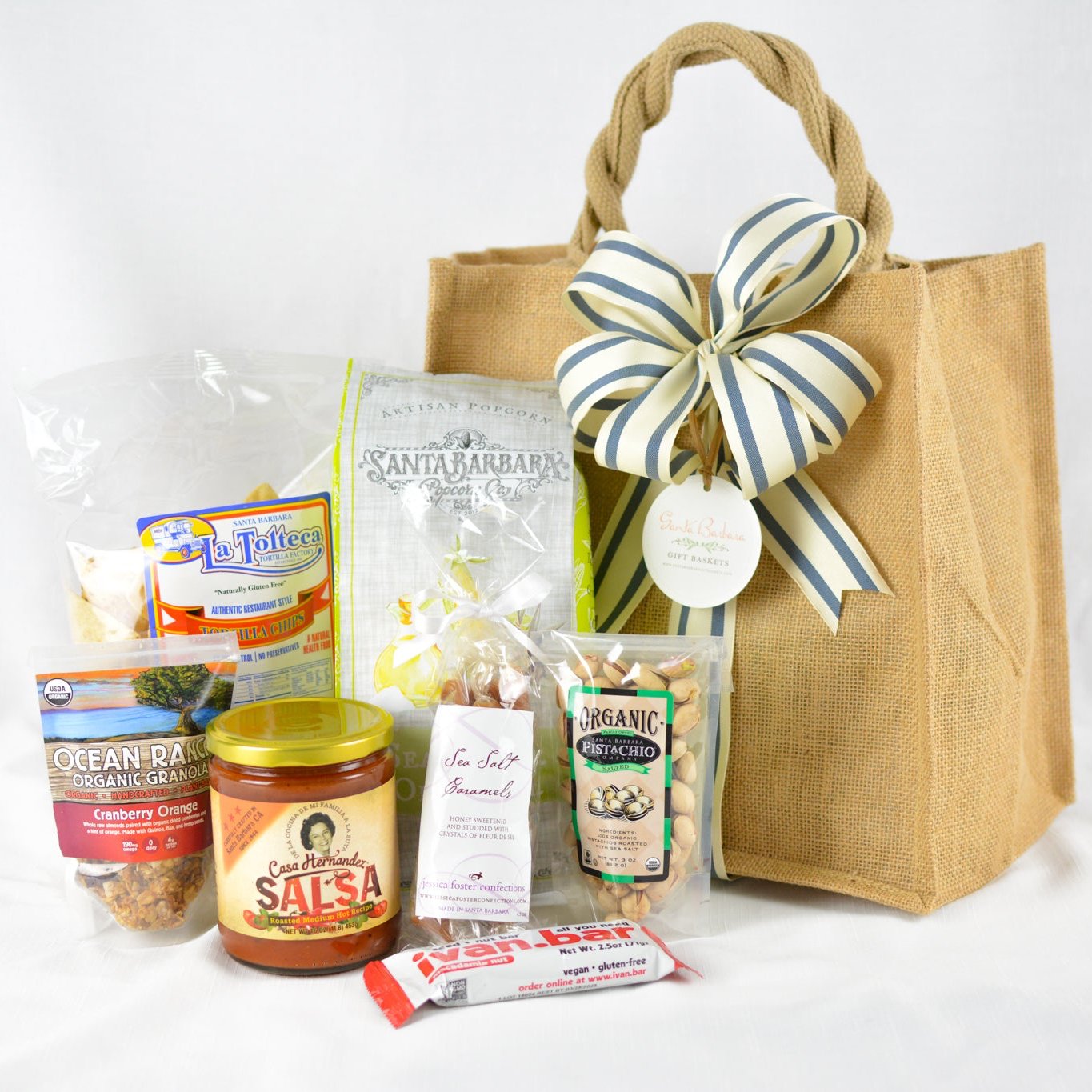 A jute tote filled with locally sourced products from Santa Barbara California. A perfect gift for the foodie.