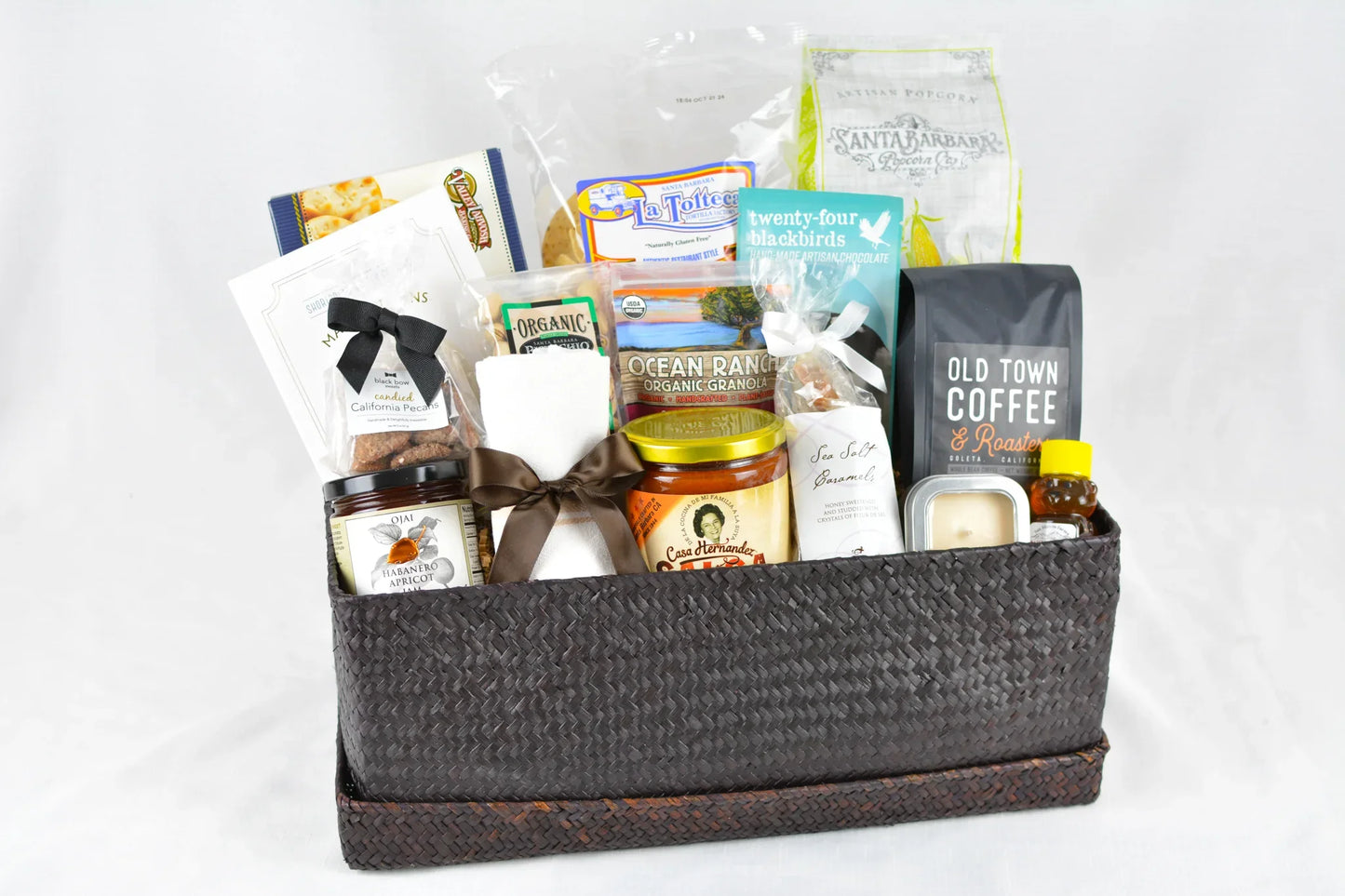 Woven gift basket with organic granola, Old Town Coffee, artisan popcorn, maple candies, and jam