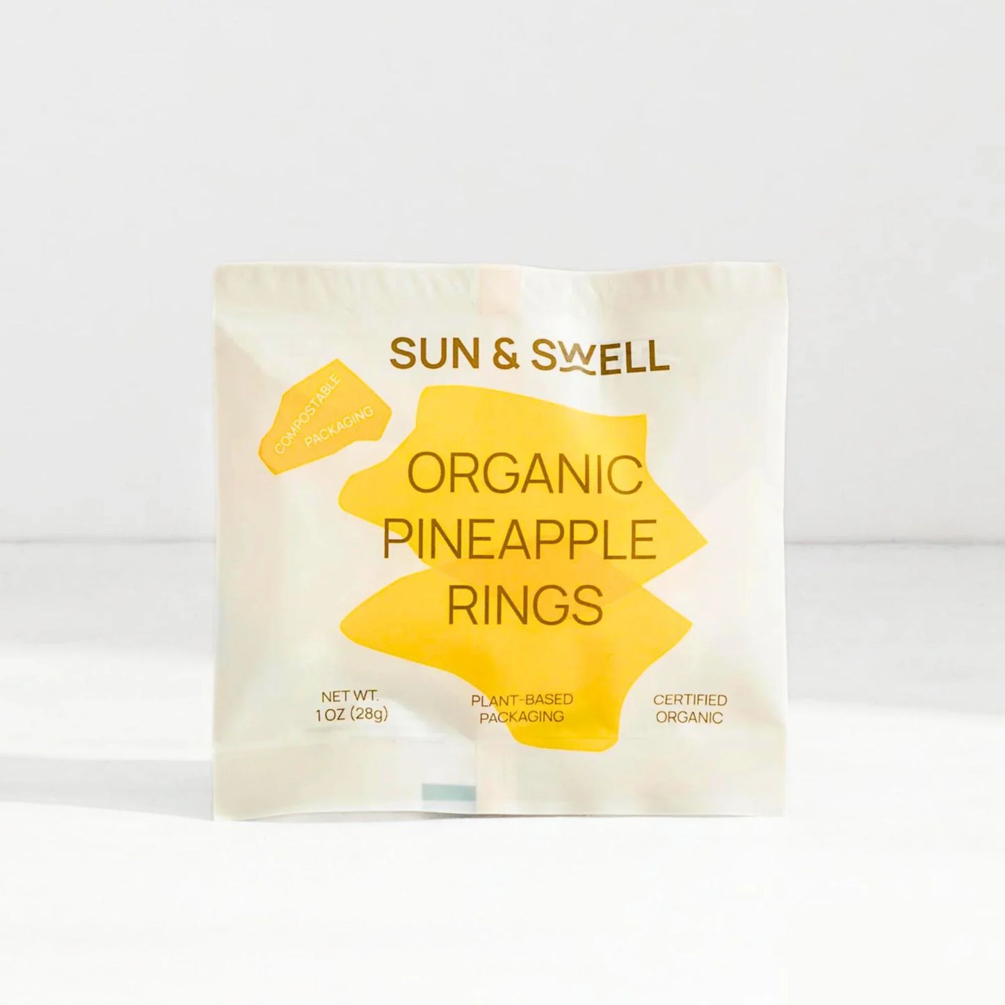 Sun & Swell organic pineapple rings in compostable, plant-based packaging, certified organic snack