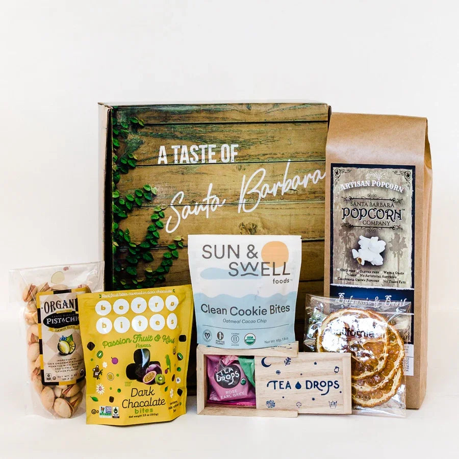 Gourmet gift box with Santa Barbara theme including pistachios, dark chocolate bites, clean cookie bites, artisan popcorn, tea drops, and dried citrus